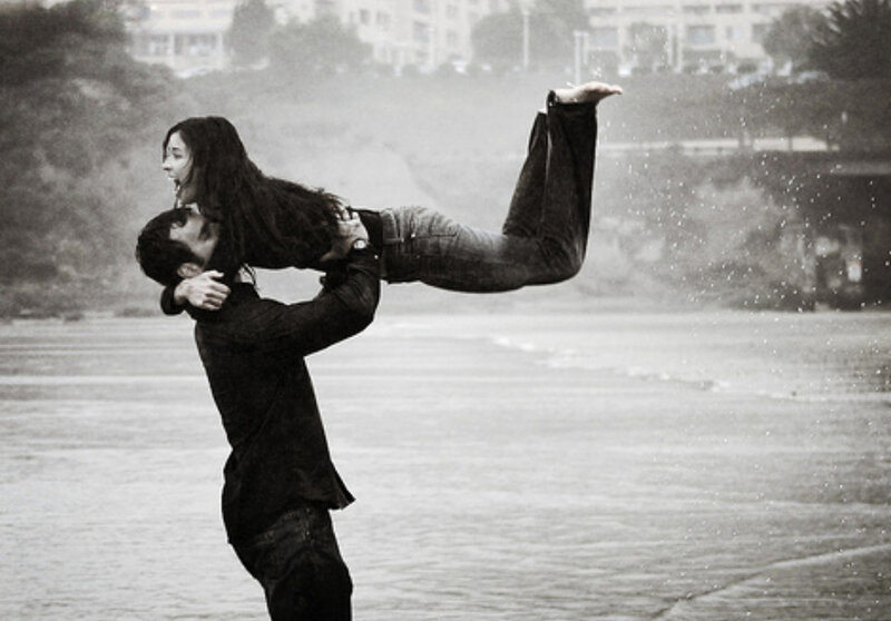 Couple playing in the rain