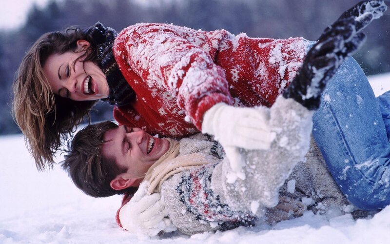 Couple playing in the snow
