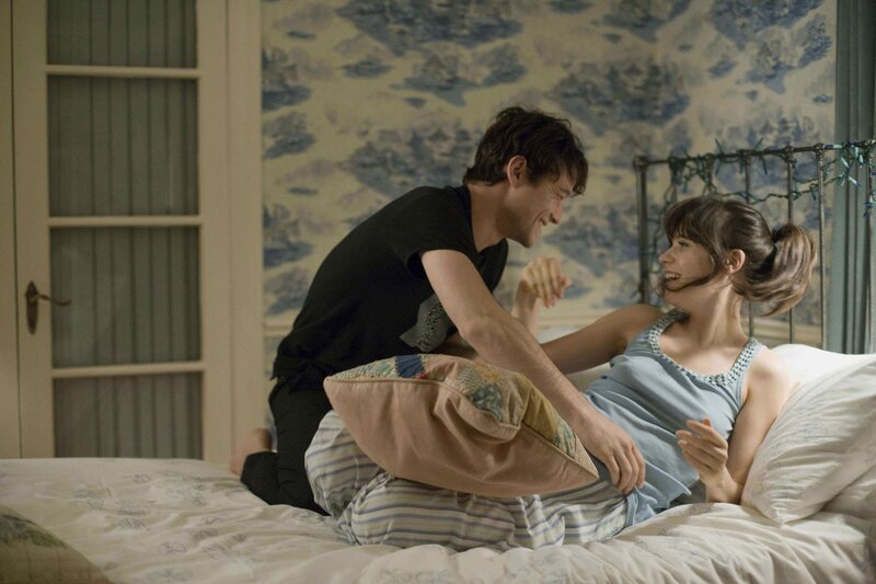 Couple playing on bed