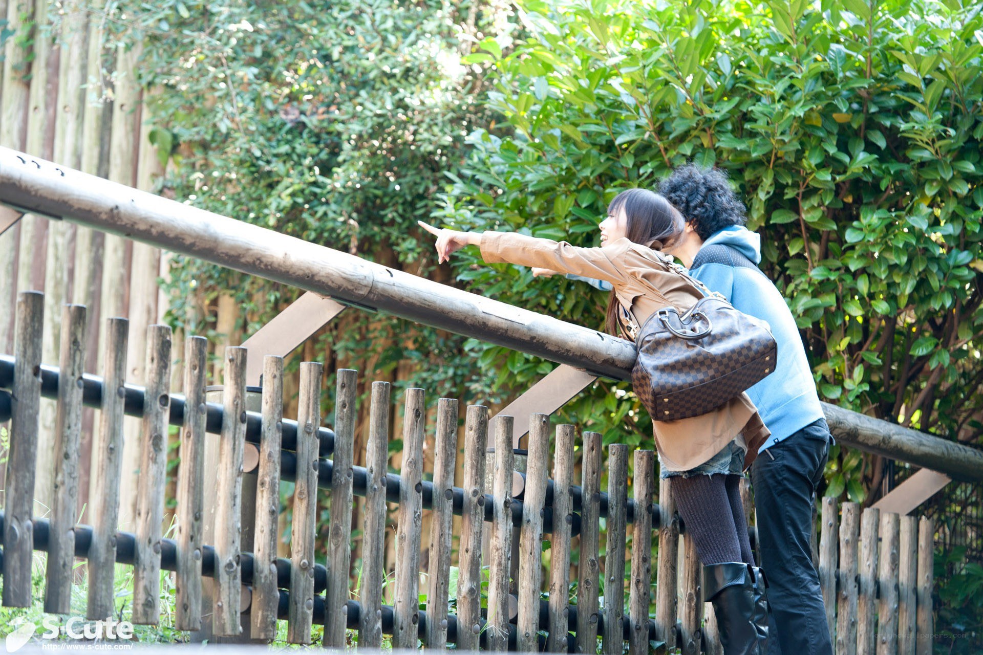 Couple pointing at something