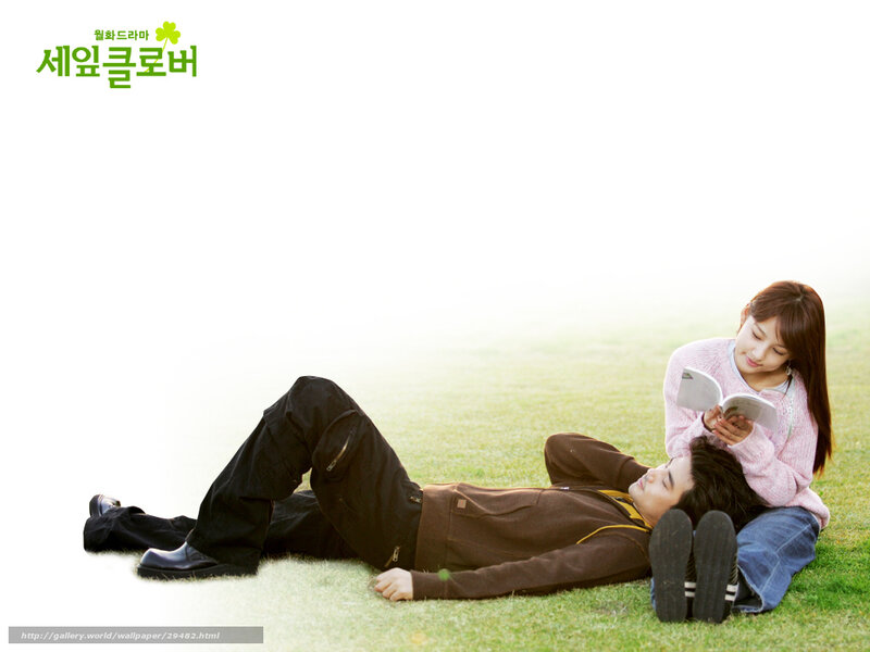 Couple reading in a field