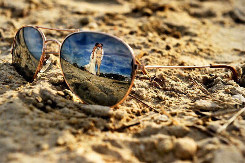 Couple Reflection in Sunglasses