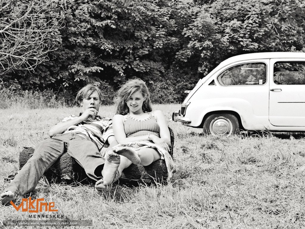 Couple relaxing in field