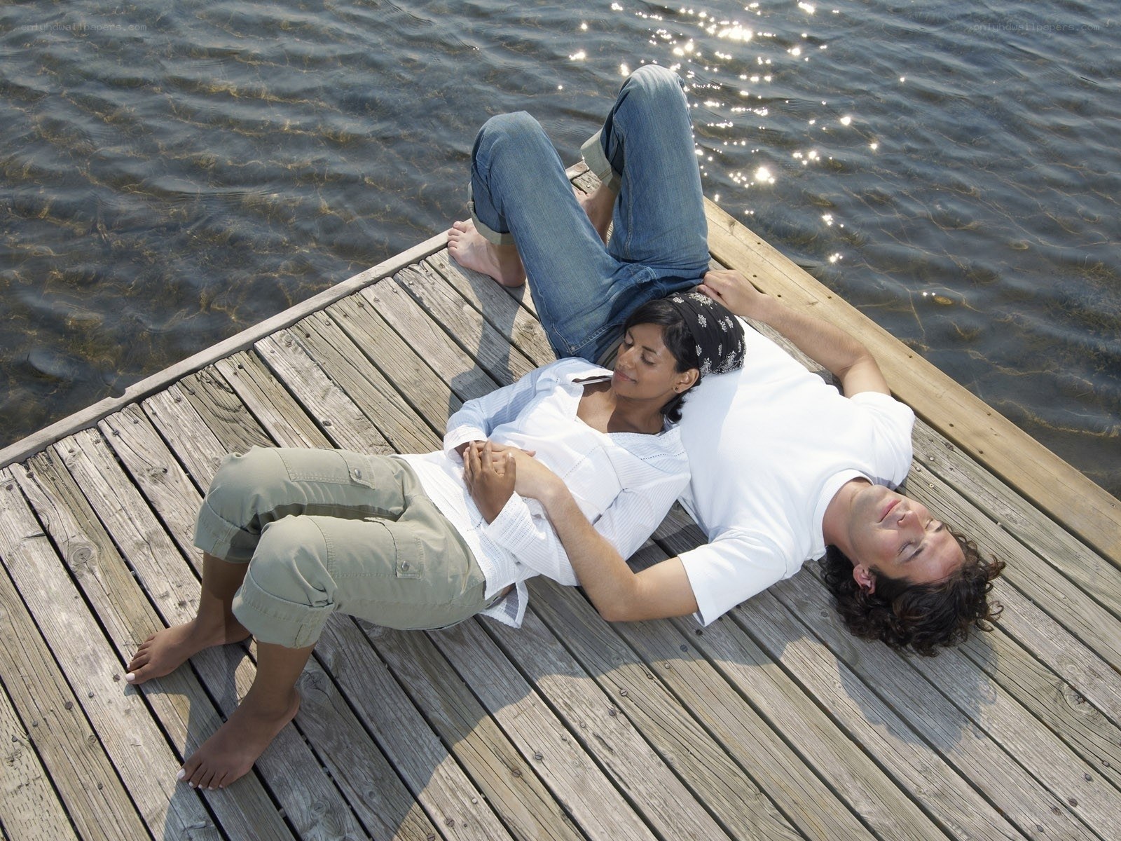 Couple relaxing on a dock