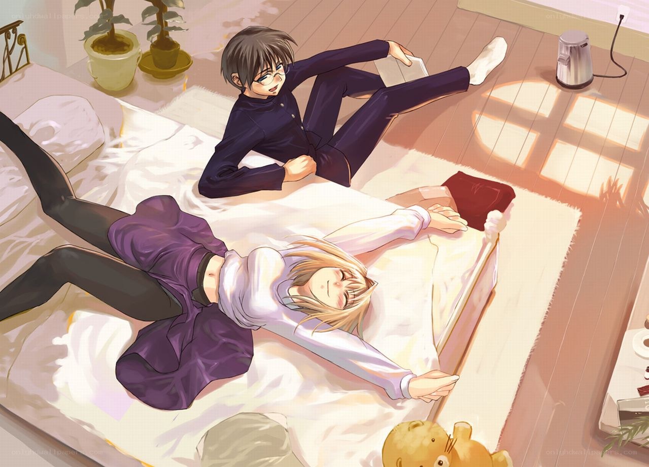 Couple relaxing on bed