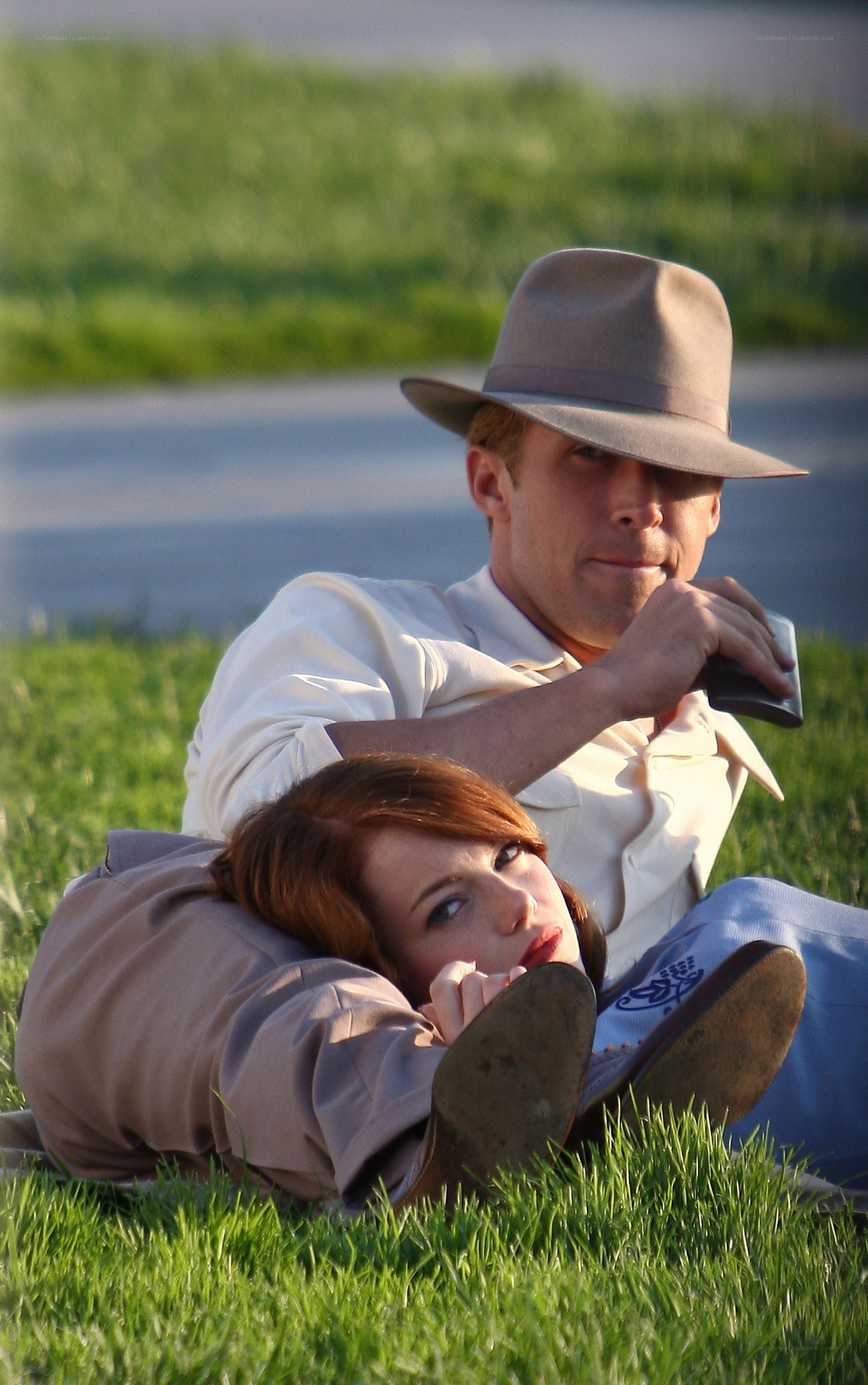 Couple relaxing on grass