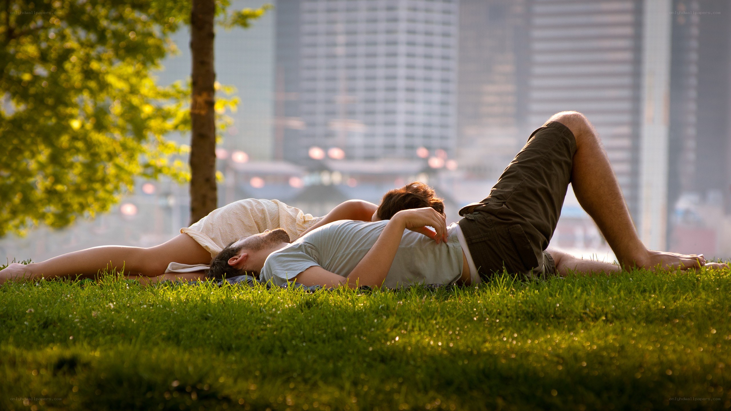 Couple relaxing on grass