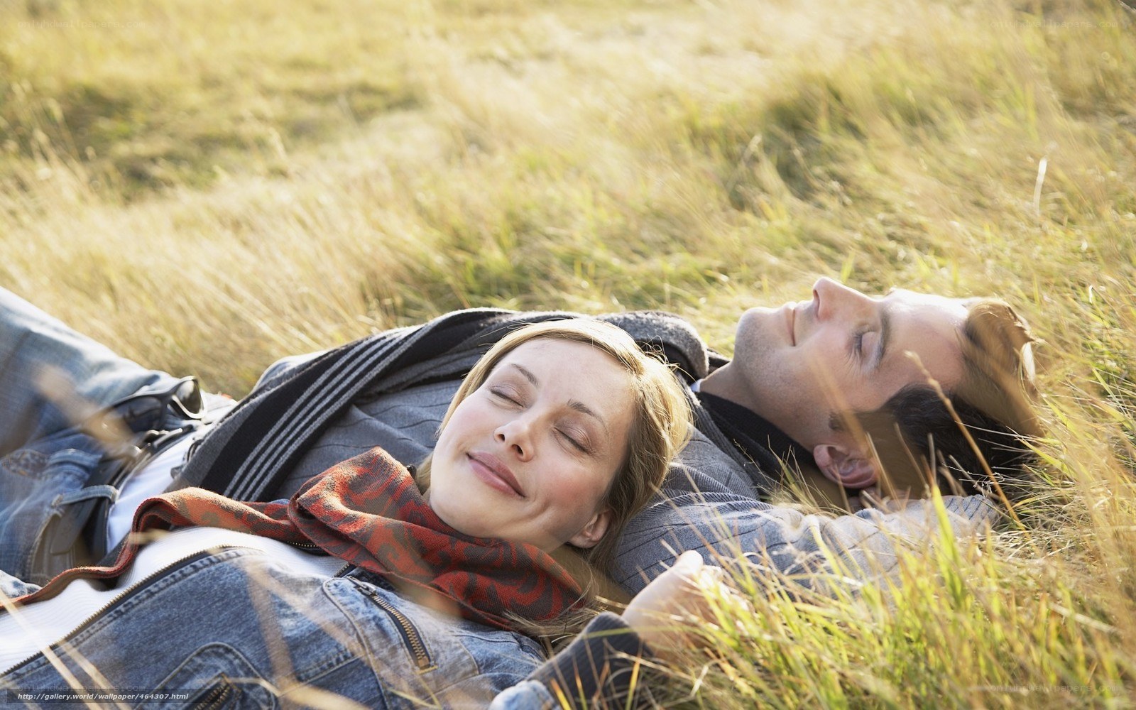 Couple resting in a field