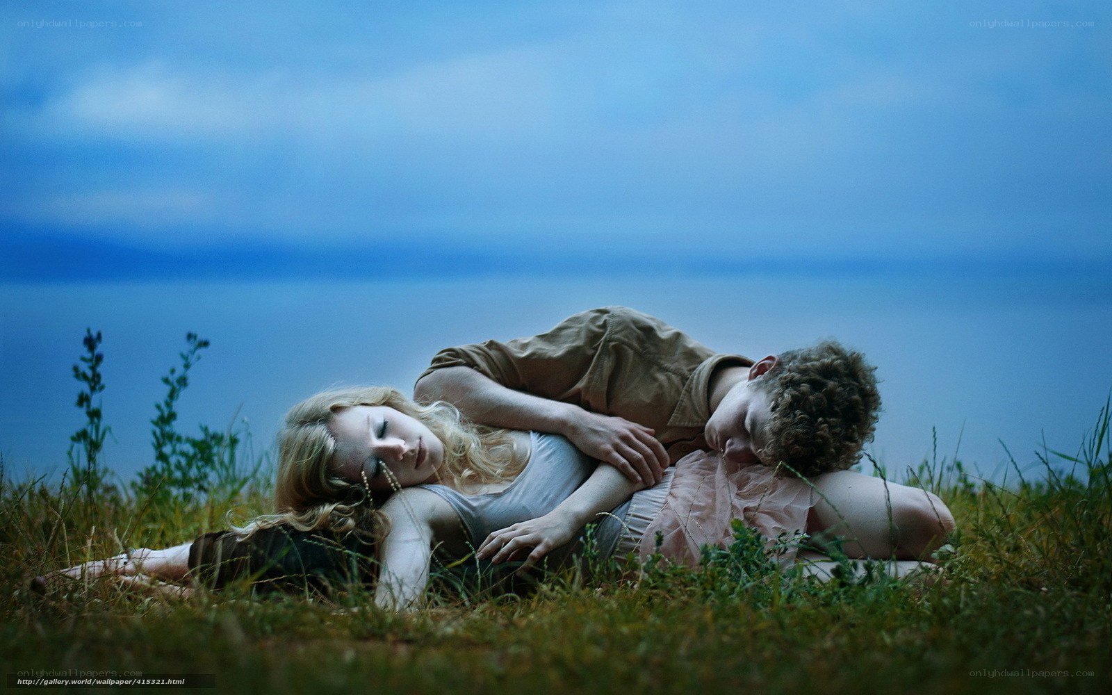 Couple resting on a hillside