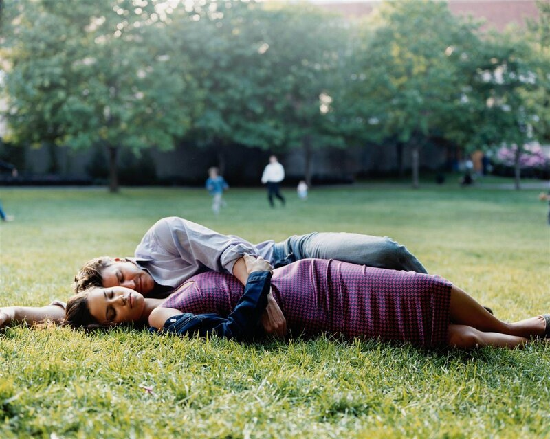 Couple resting on grass