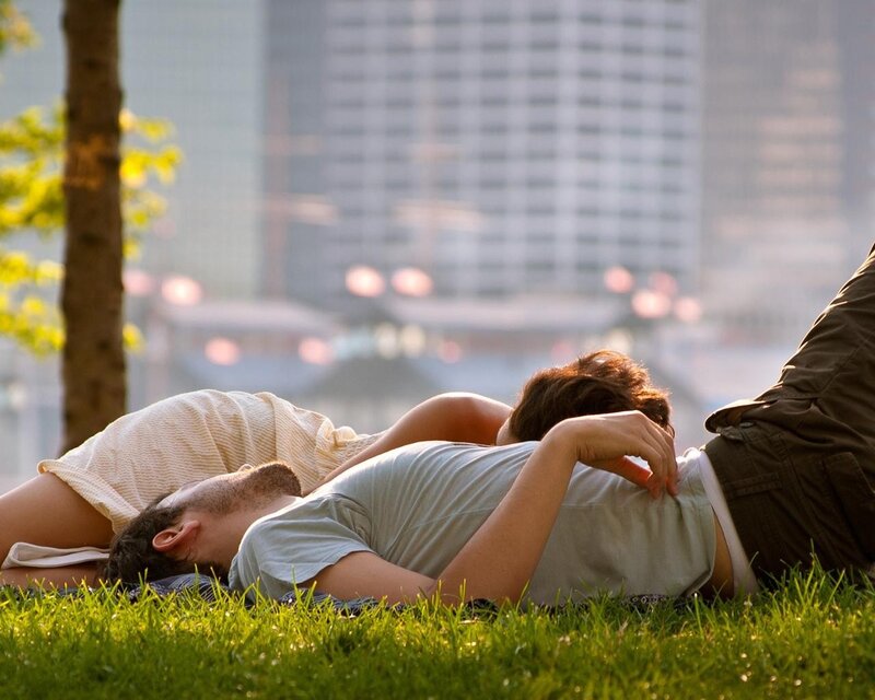 Couple resting on grass