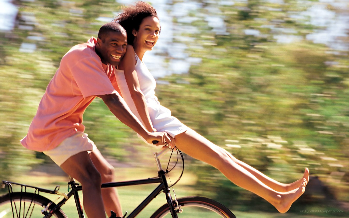 Couple riding a bicycle together