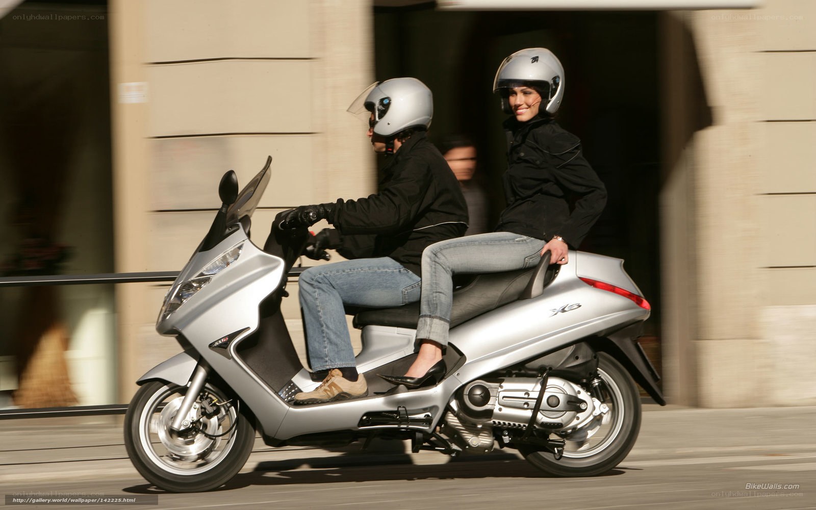 Couple riding a scooter
