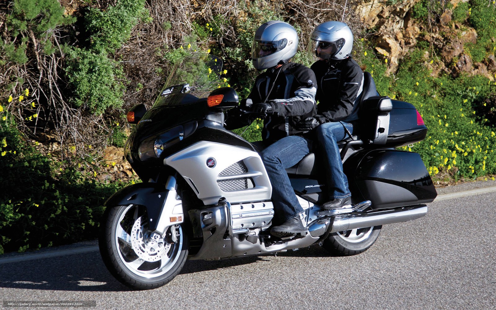 Couple riding a touring motorcycle