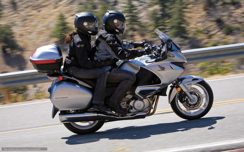 Couple riding a touring motorcycle