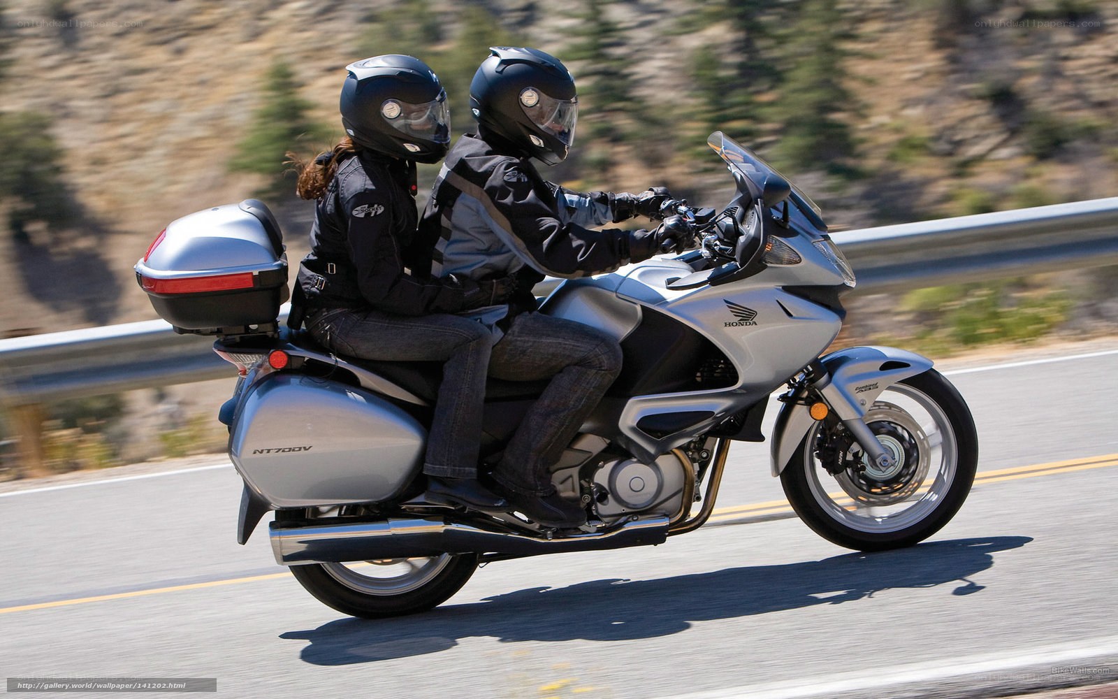 Couple riding a touring motorcycle