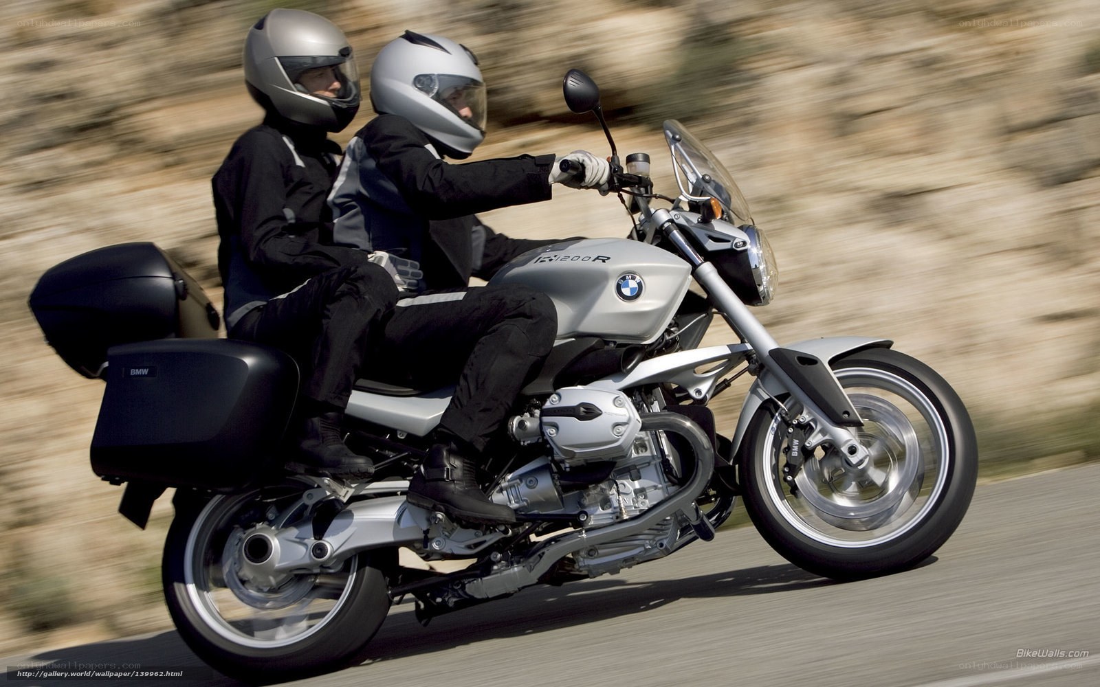 Couple riding BMW motorcycle
