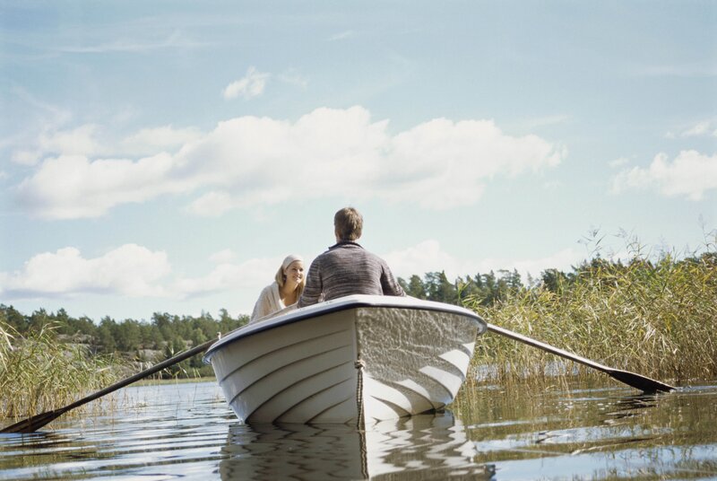 Couple rowing a boat
