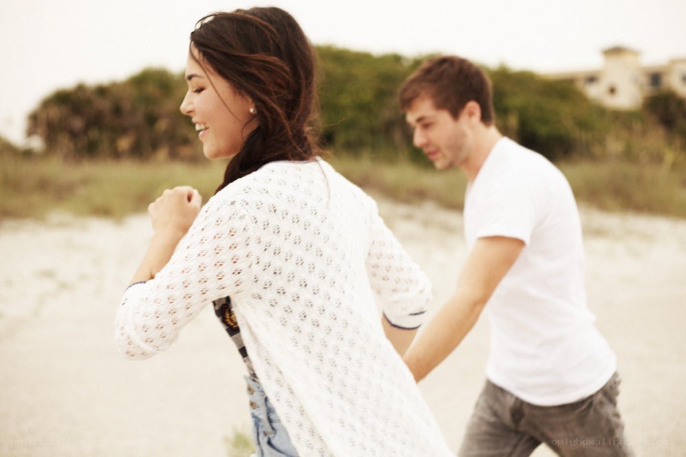 couple running on beach