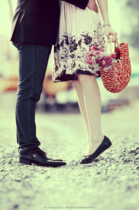Couple's feet on gravel