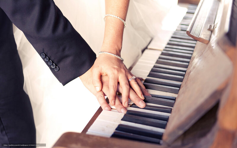 Couple's Hands on Piano