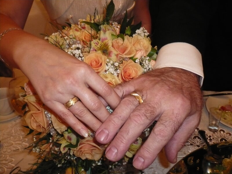 Couple's Hands with Rings