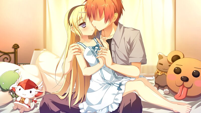 couple sharing a kiss on bed