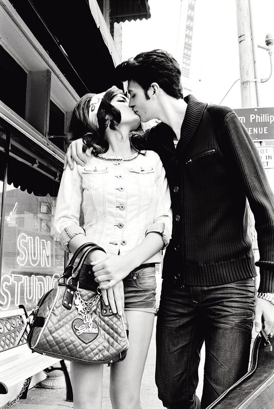Couple sharing a kiss on the street
