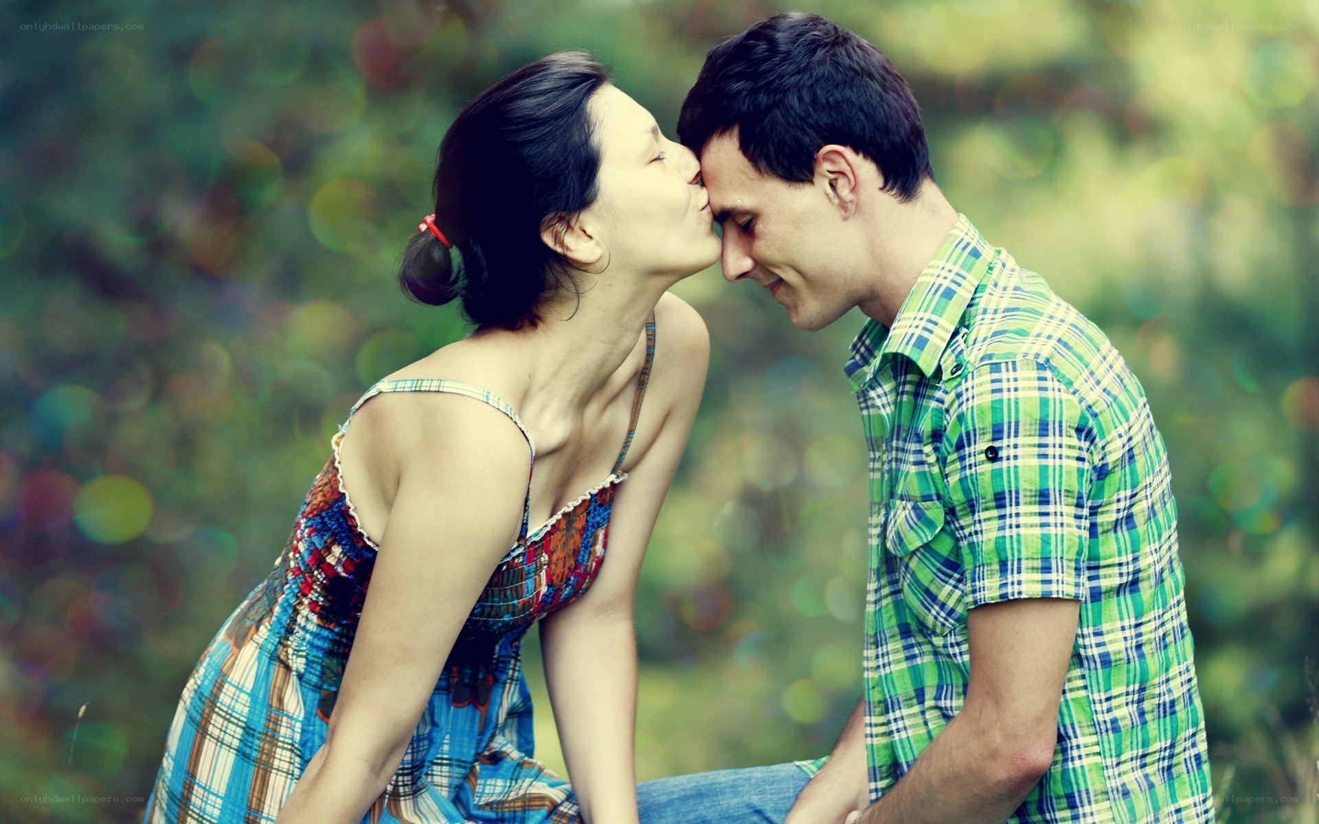 Couple sharing a kiss outdoors