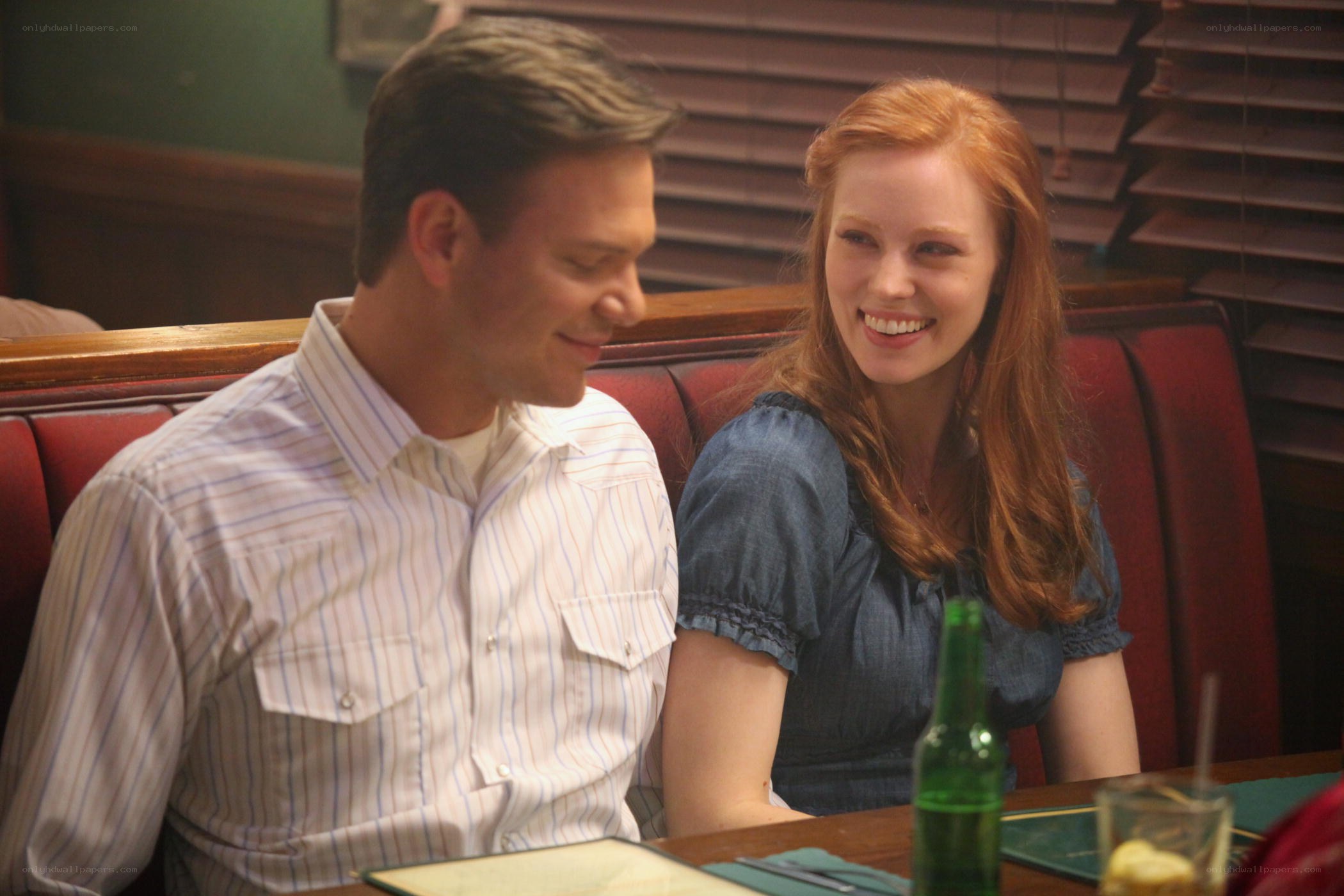 Couple sharing a meal at a diner