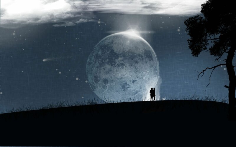 Couple Silhouetted Against Moon