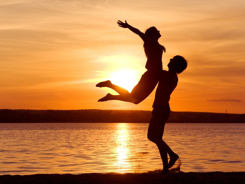 Couple Silhouetted at Sunset — Orange, Dramatic, Photograph, Lake