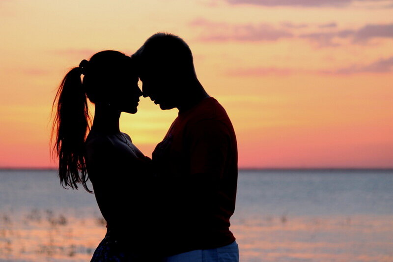 Couple Silhouetted at Sunset — Orange, Serene, Photograph
