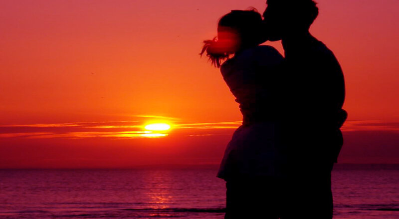 Couple Silhouetted at Sunset — Red