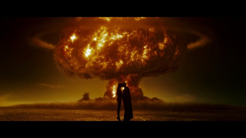couple silhouetted by explosion