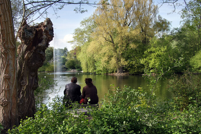 Couple Sitting by Pond