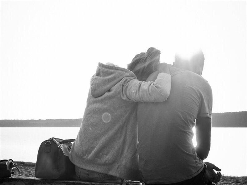 Couple Sitting by Water