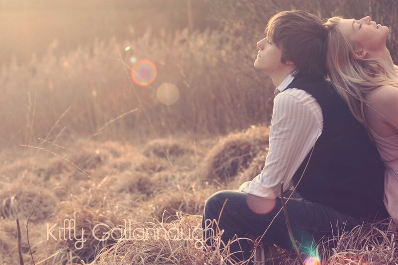 Couple Sitting in Field