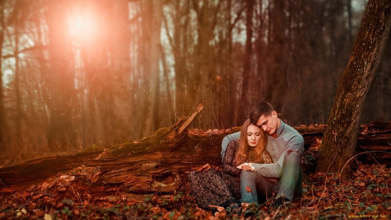 Couple Sitting in Forest