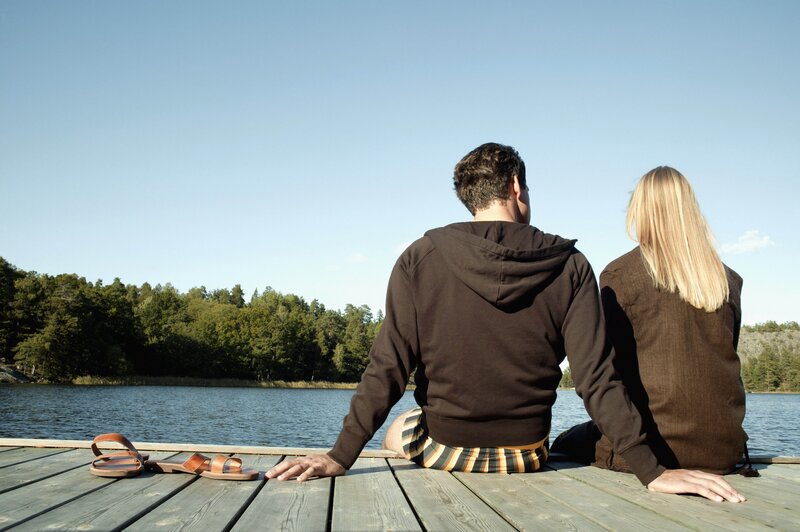 Couple sitting on a dock