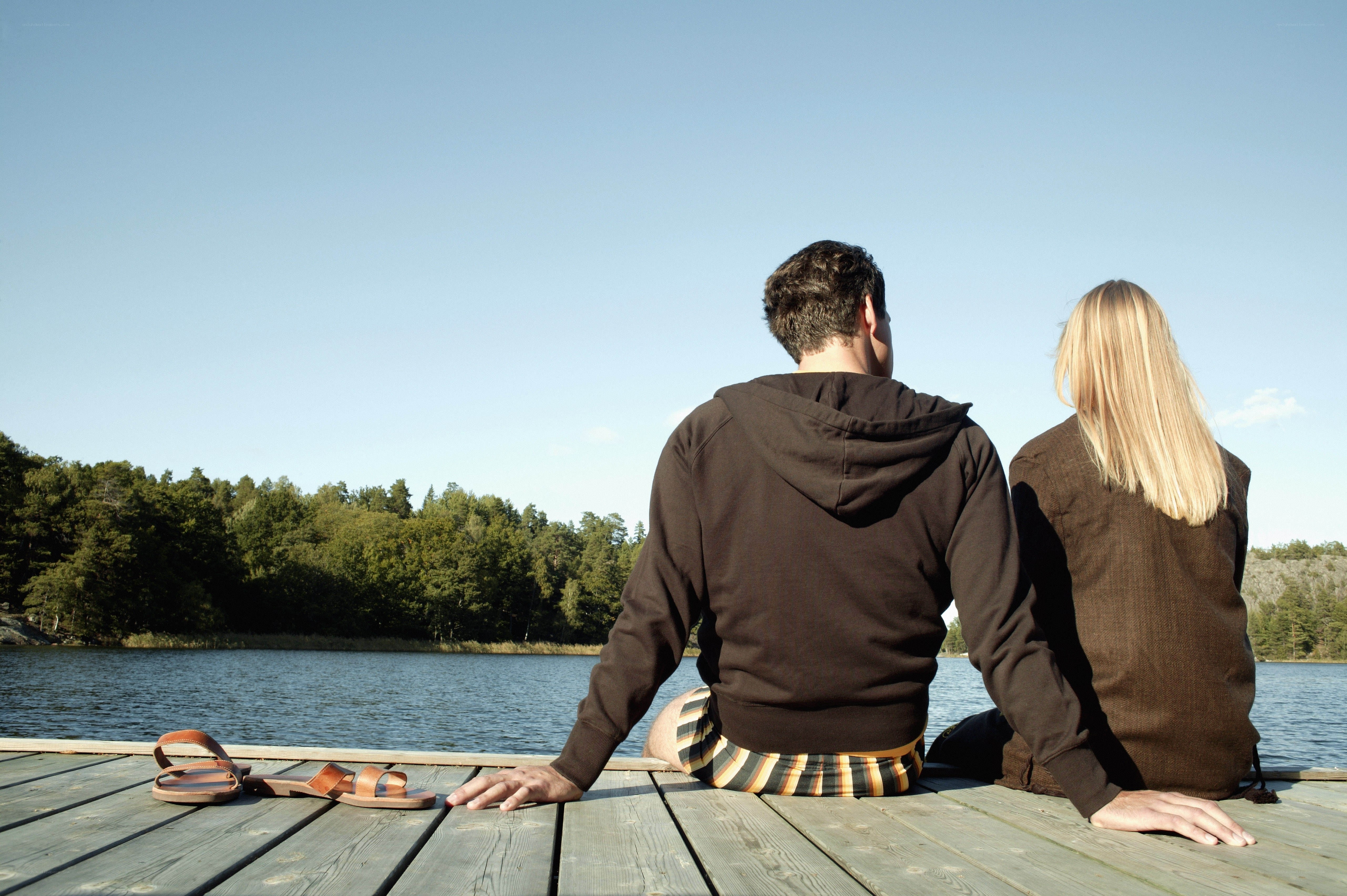 Couple sitting on a dock