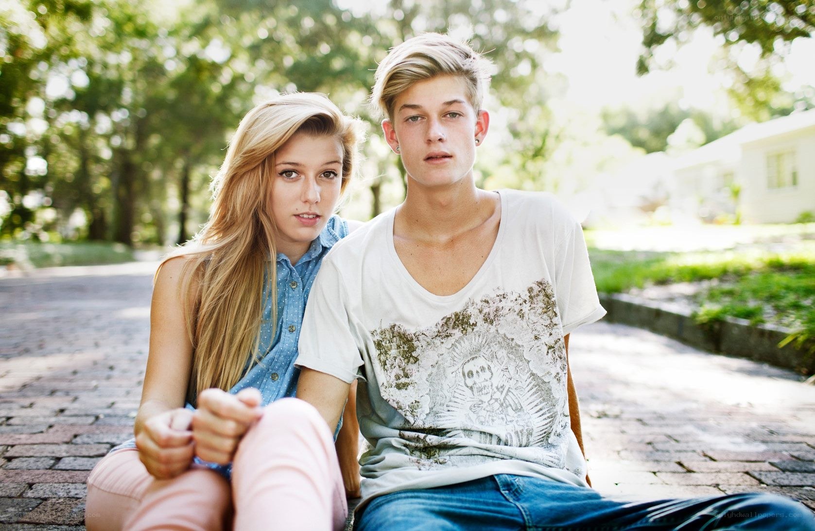 couple sitting on a path