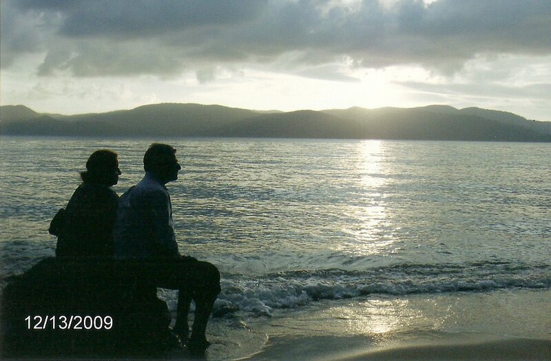 Couple Sitting on Beach — Gray