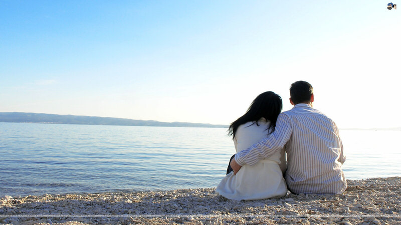 Couple Sitting on Beach