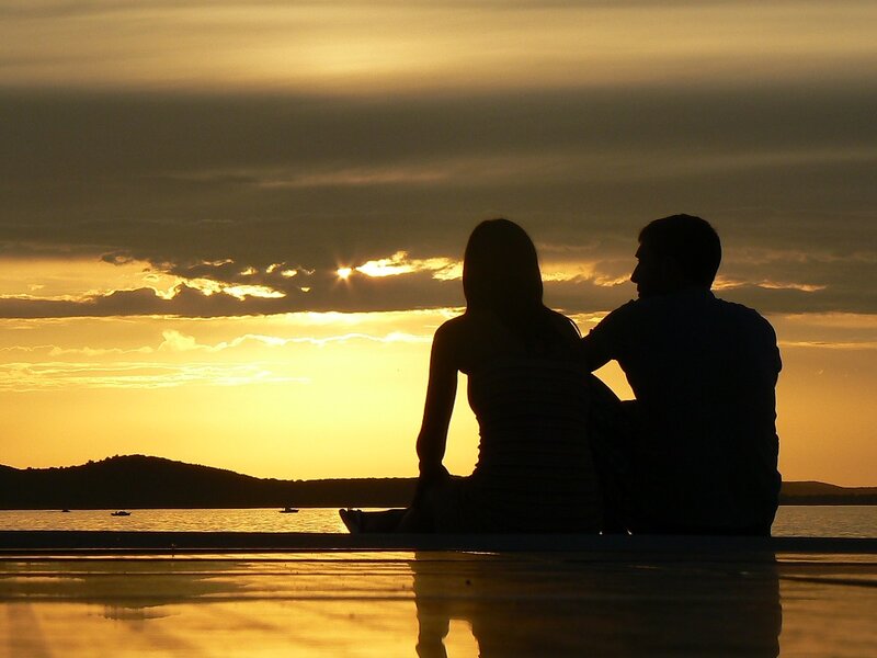 Couple Sitting on Dock