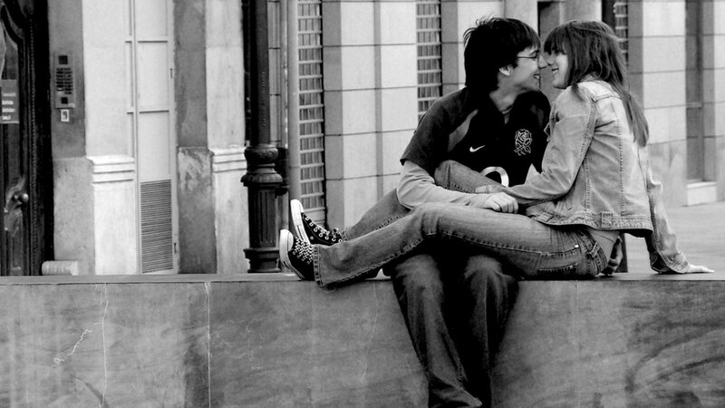 Couple Sitting on Ledge