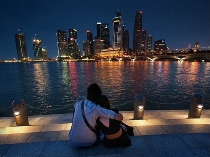 Couple Sitting on Pier — Blue