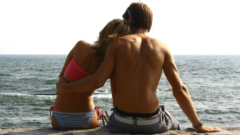 Couple Sitting on Pier