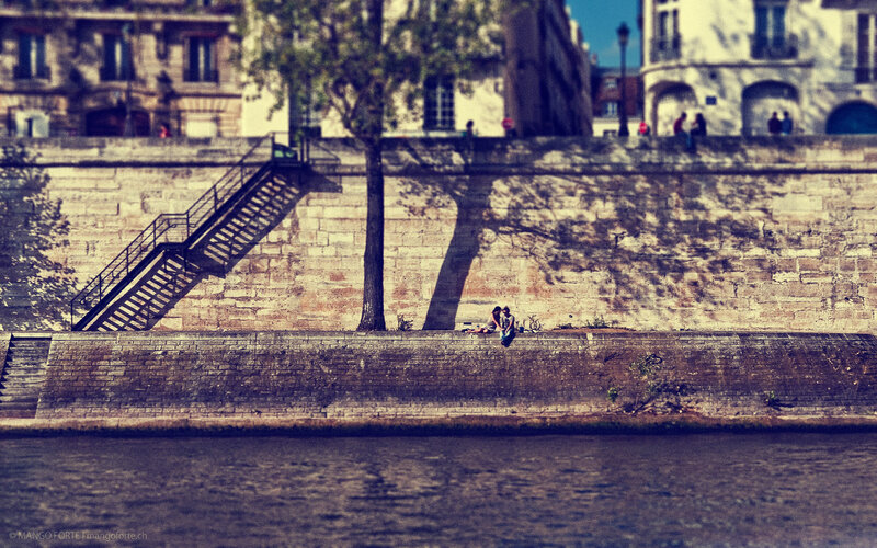 Couple Sitting on Riverbank
