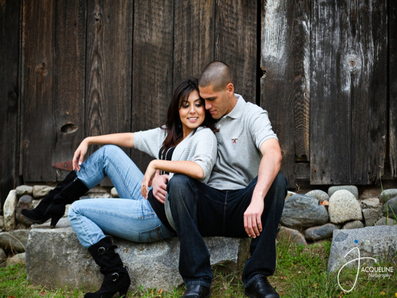 Couple Sitting on Rocks — Brown